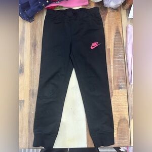 Nike Kids Black slim fit Joggers with Pink Logo